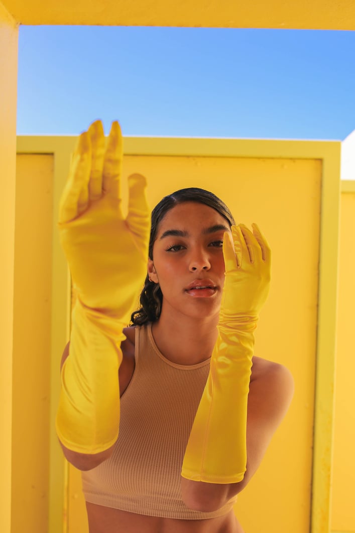 Woman Wearing Yellow Gloves